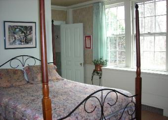 A four poster bed and private bath are features of our Charleston Room